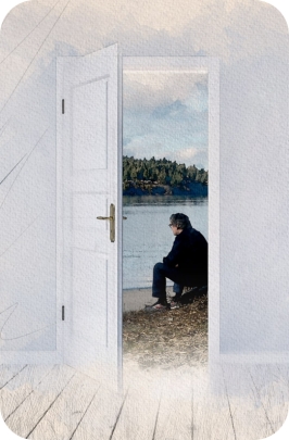 Image of an open doorway with Mike pearson sitting on a beach look out over the water