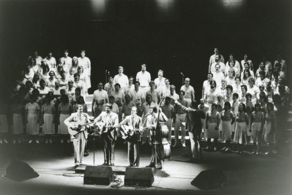 A photo of The Brothers Four and the choir.