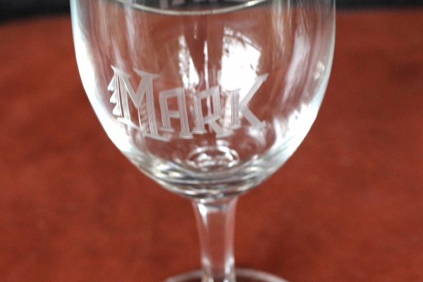 A photo of the wine glass that Sands bought and had engraved