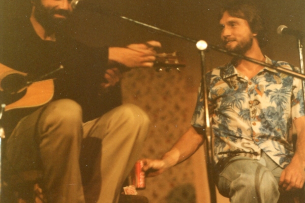 Two friends making music.