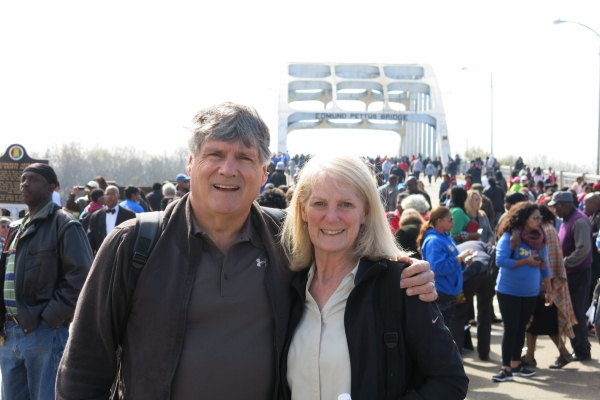 Mark and Pat standing together in front of the Edmund Pettus Bridge