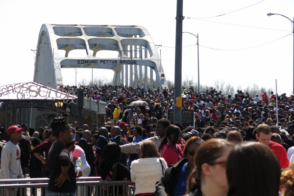 Crowd walking across the Edmund Pettus Bridge