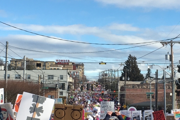 People marching in the street celebrating the 50 anniversary of the march in Selma
