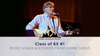 Picture of Mark Pearson singing on stage at the Class of '65 concert