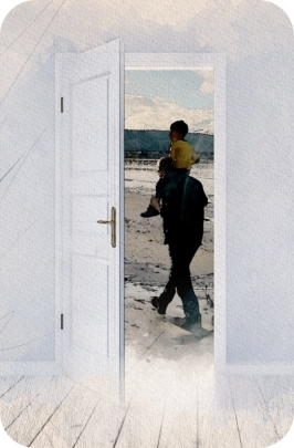 An open doorway showing Mark pearson walking on the beach with a child on his shoulders